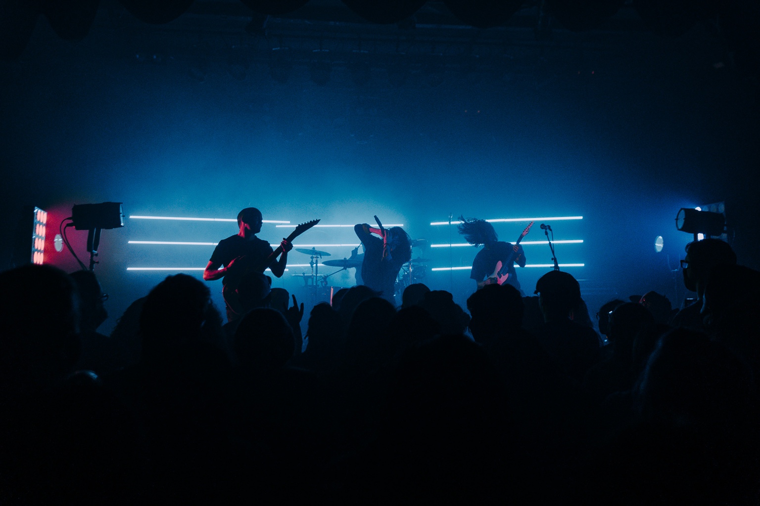 Vespera performing onstage before a crowd